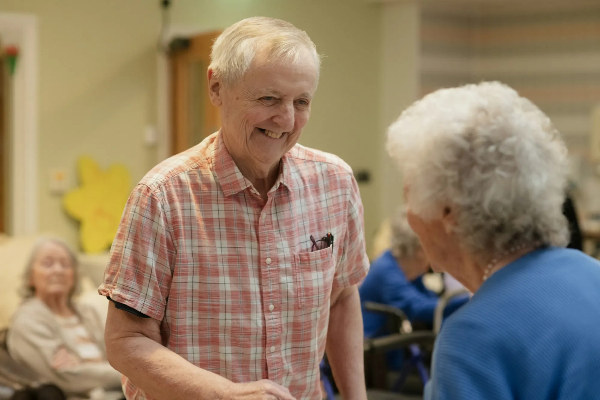 An older man and an older woman talking together