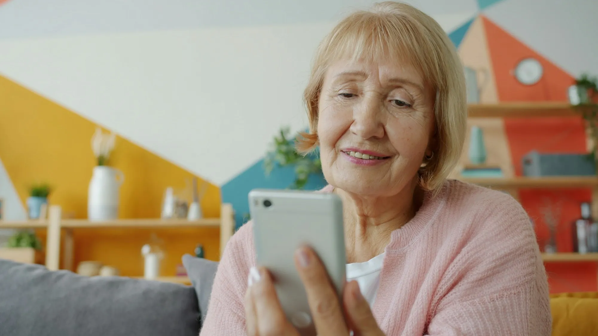 A woman talking on the telephone at home