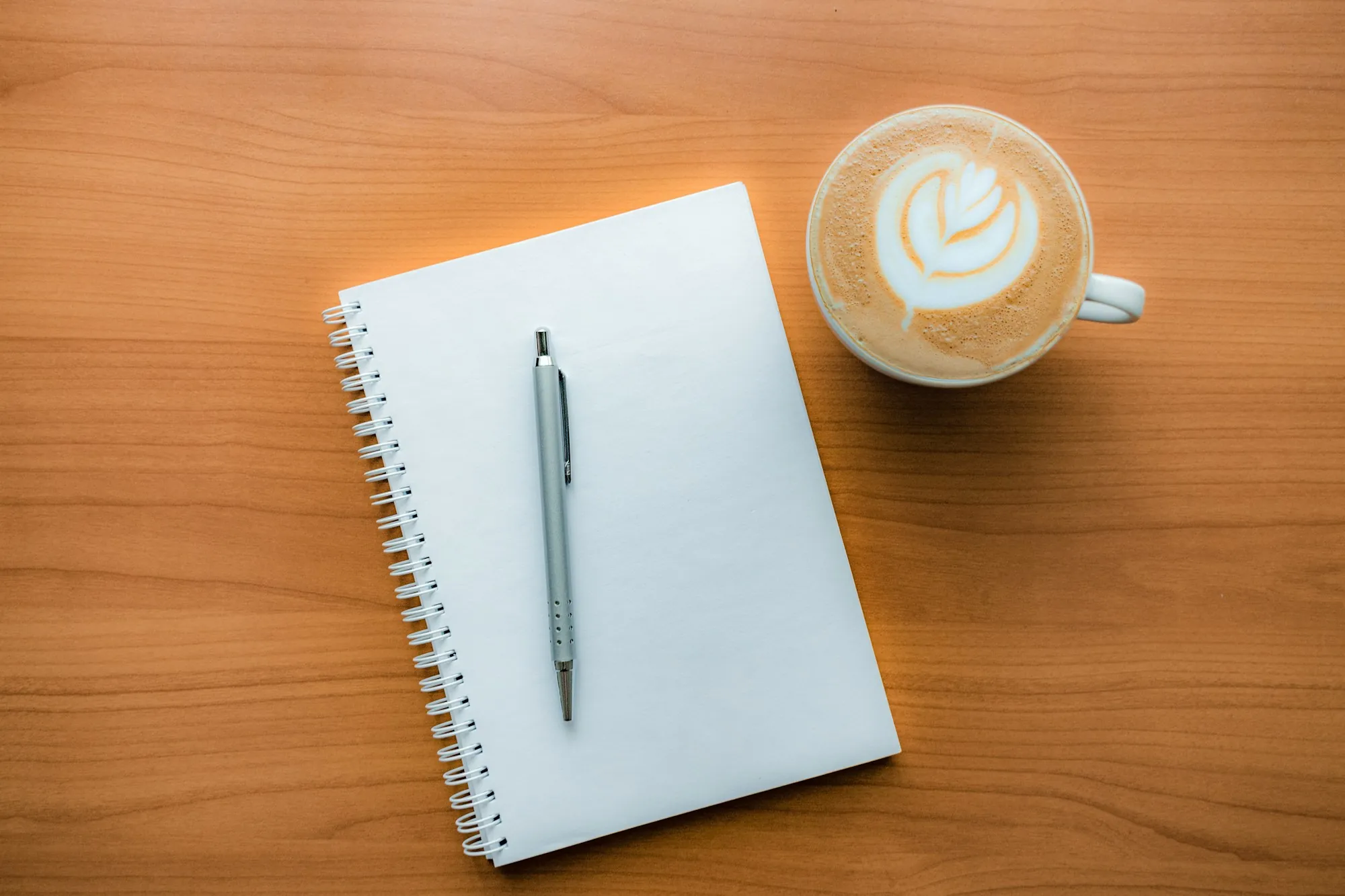 A notepad and pen on a table